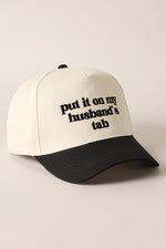 Put It On My Husbands Tab Trucker Hat